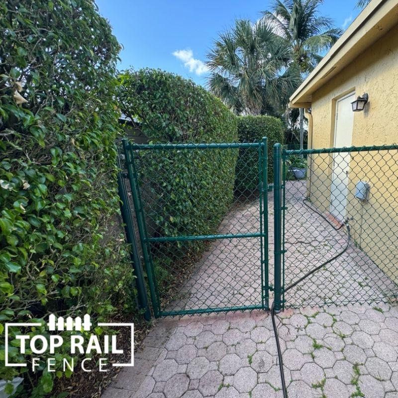 chain link fence installed by top rail fence
