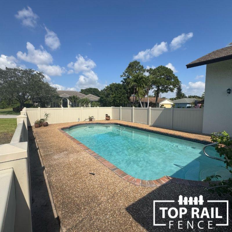 tan privacy fence installed by Top Rail Fence