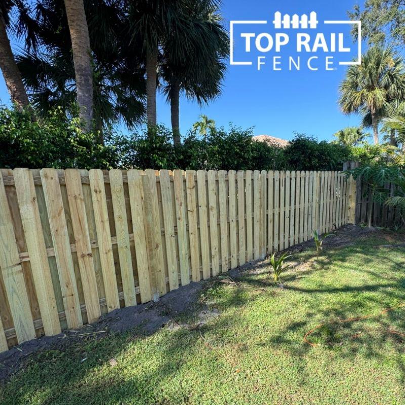 wood shadowbox fence installed by top rail fence