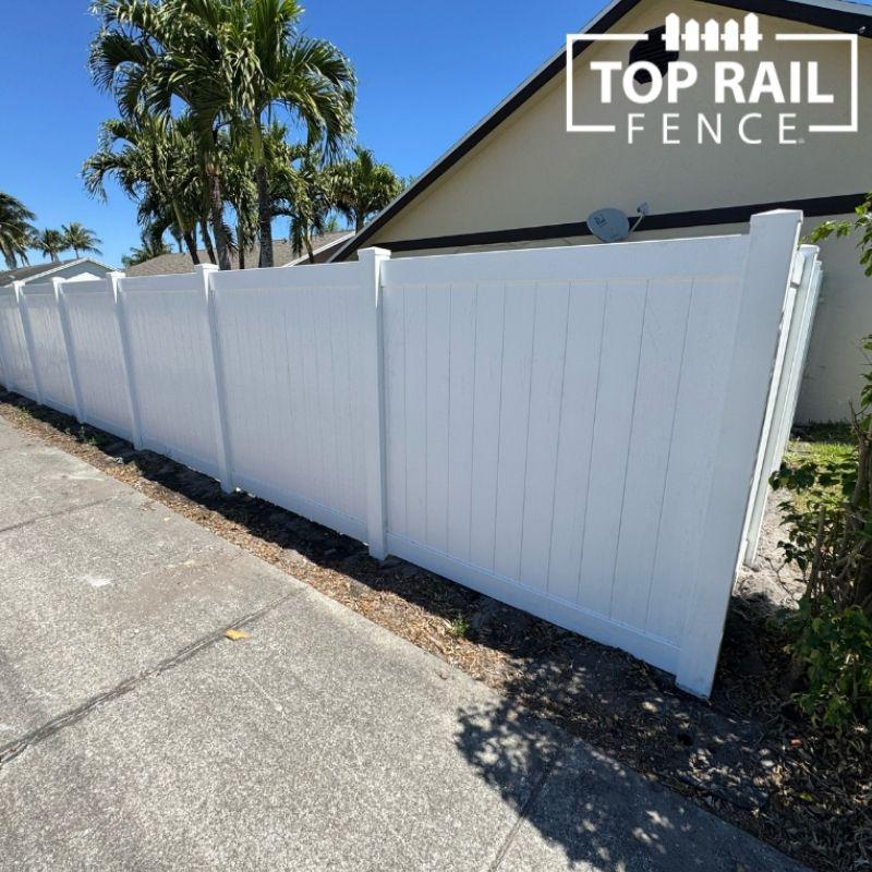 white vinyl fence installed by Top Rail Fence