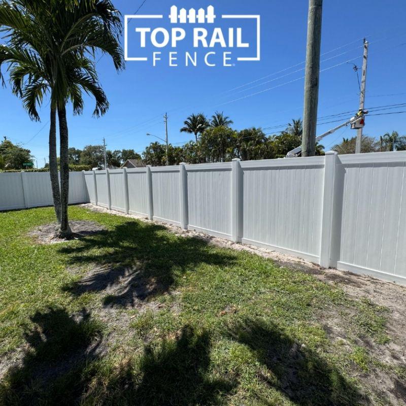 white vinyl fence installed by Top Rail Fence