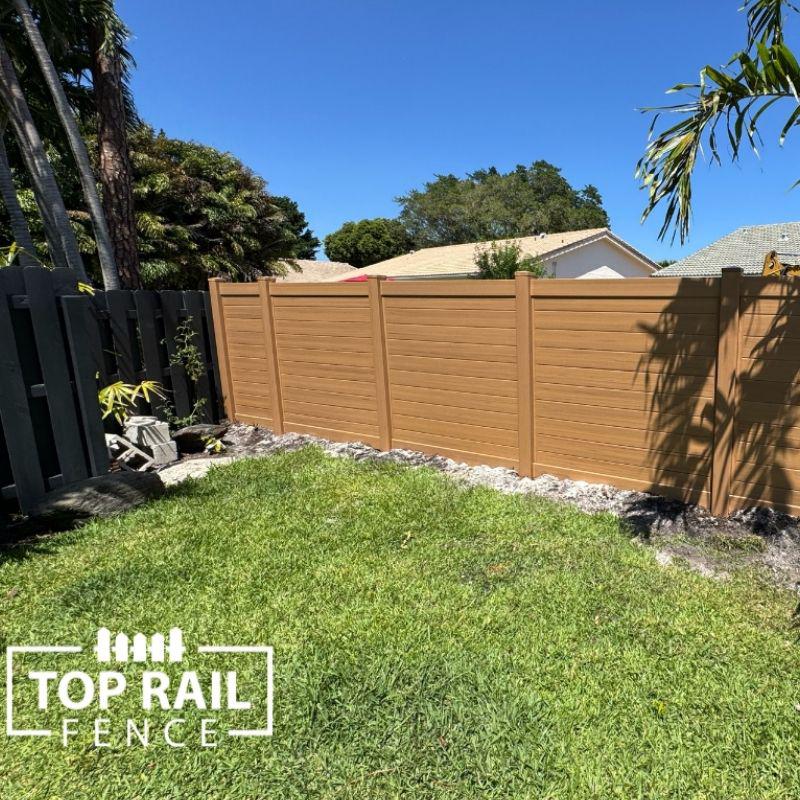 Horizontal Cypress Vinyl Fence Installation by Top Rail Fence
