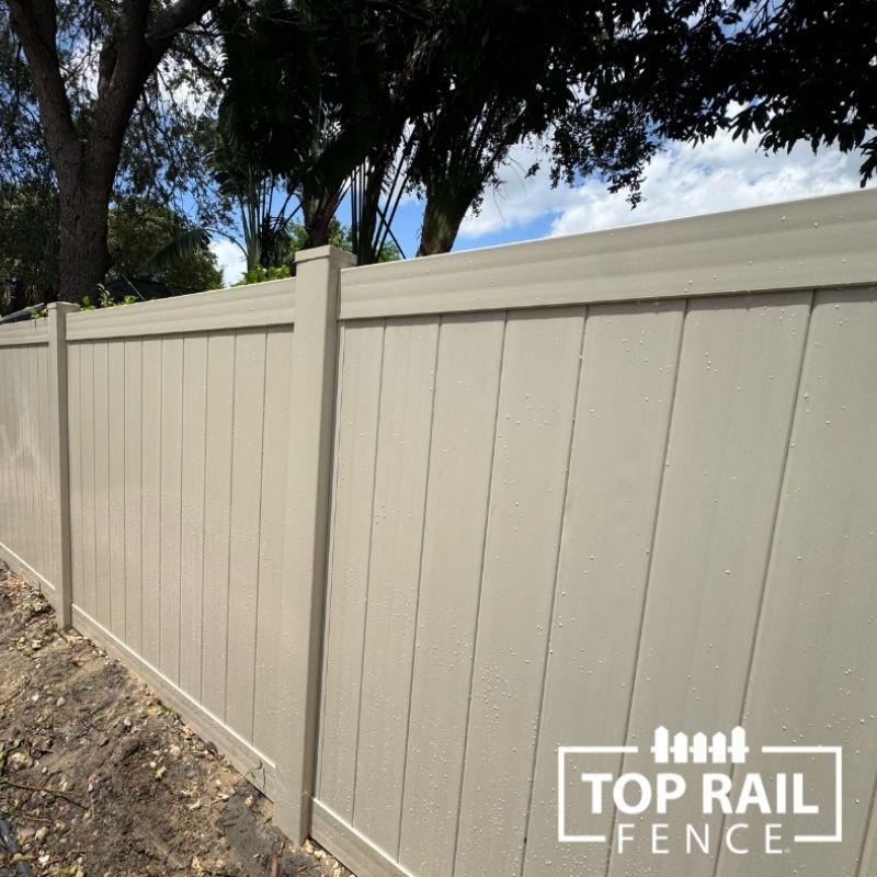 Tan Vinyl Fence installed by Top Rail Fence