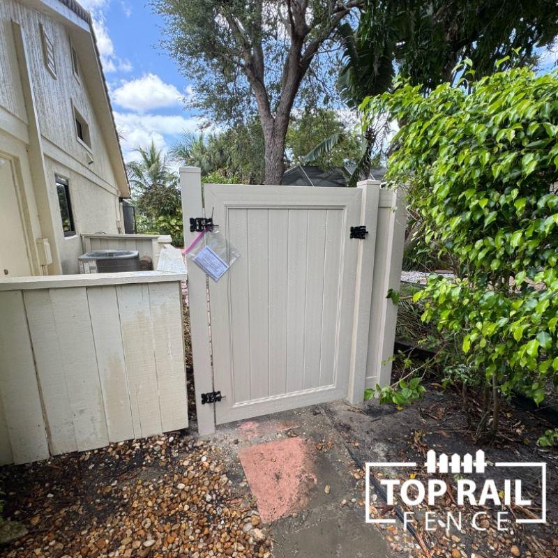 Tan Vinyl Fence installed by Top Rail Fence