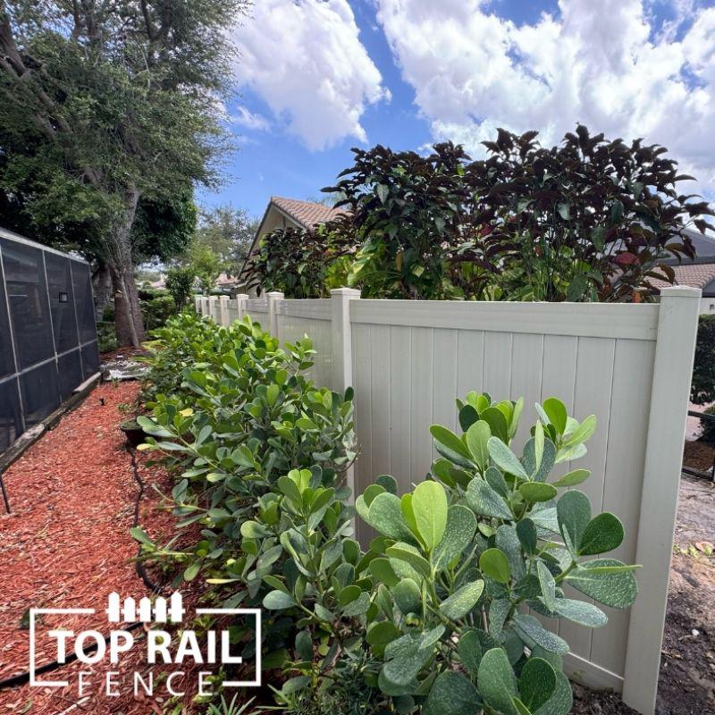 Tan Vinyl Fence installed by Top Rail Fence