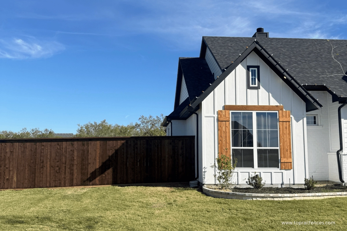 A nice home with a stained cedar fence