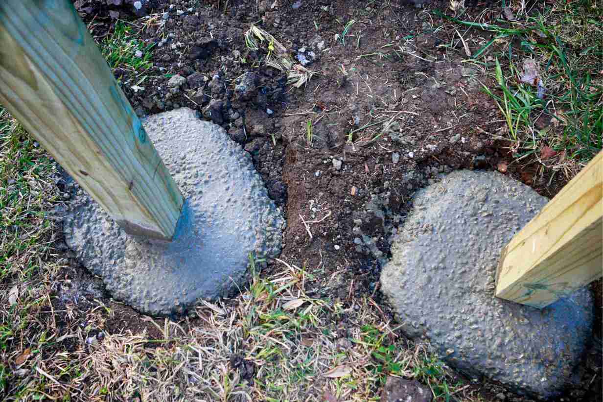 wet-setting-fence-posts-wood-concrete