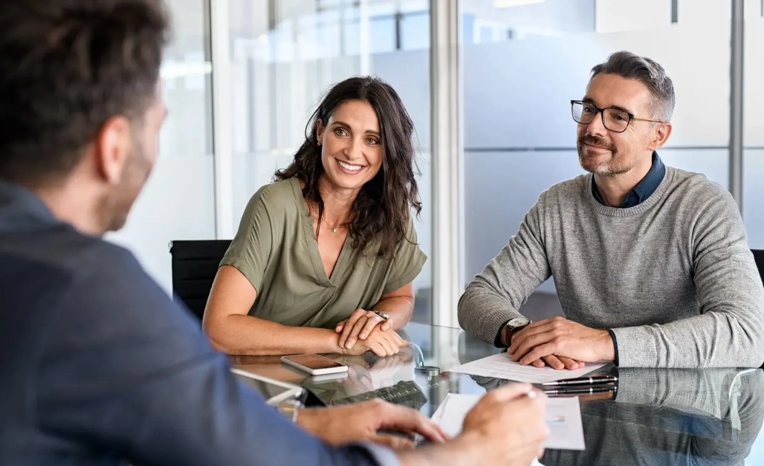 Man and woman discuss financing a fence