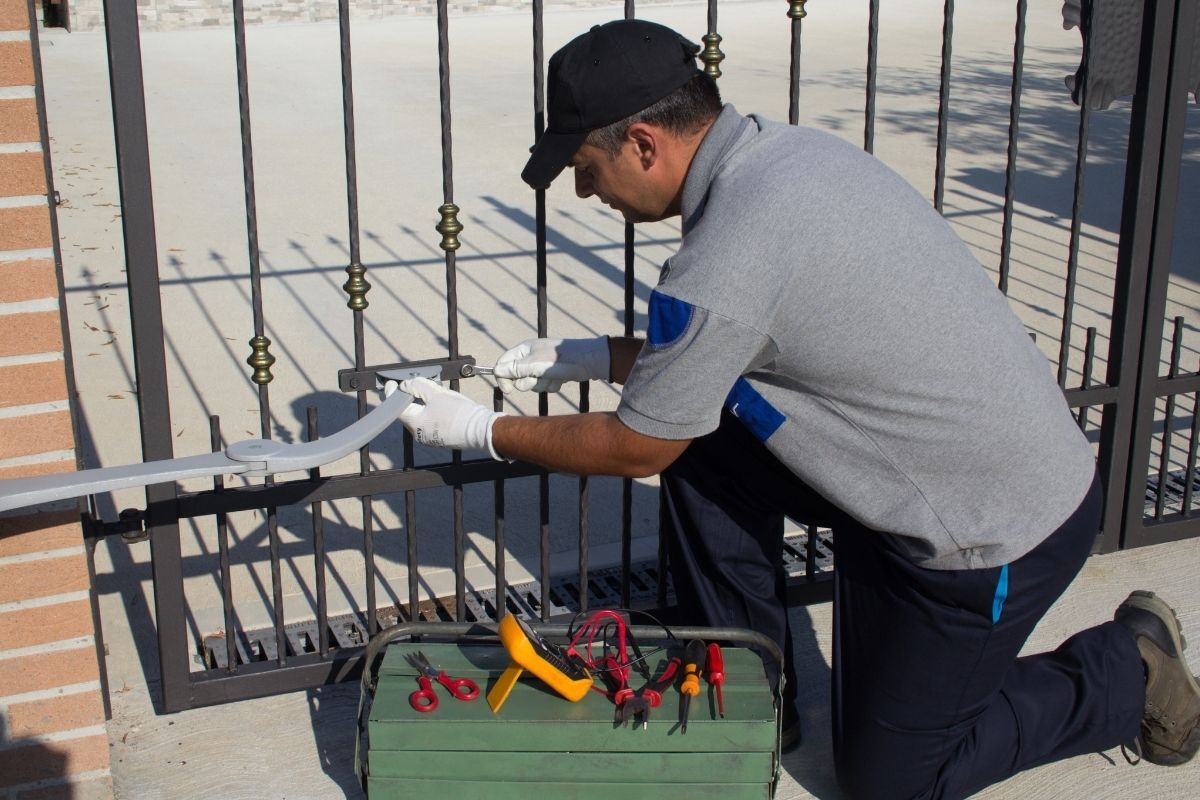 Man fixing an automatic gate