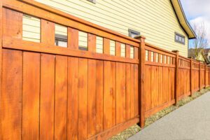 Wood fence with decorative topper