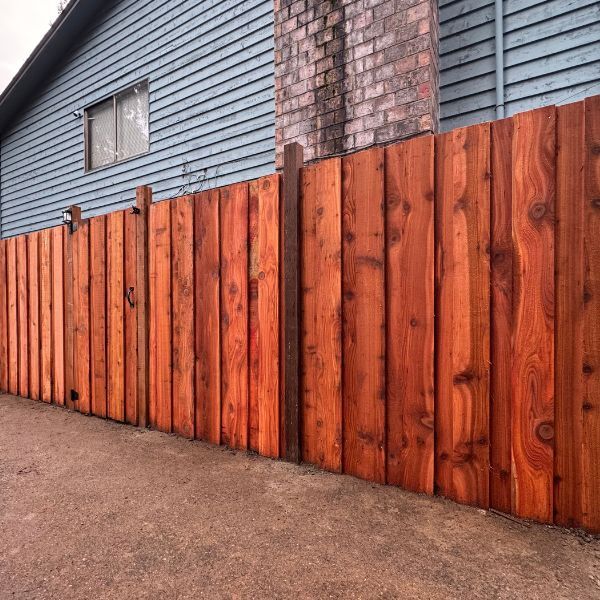 Stained wood fence board on board