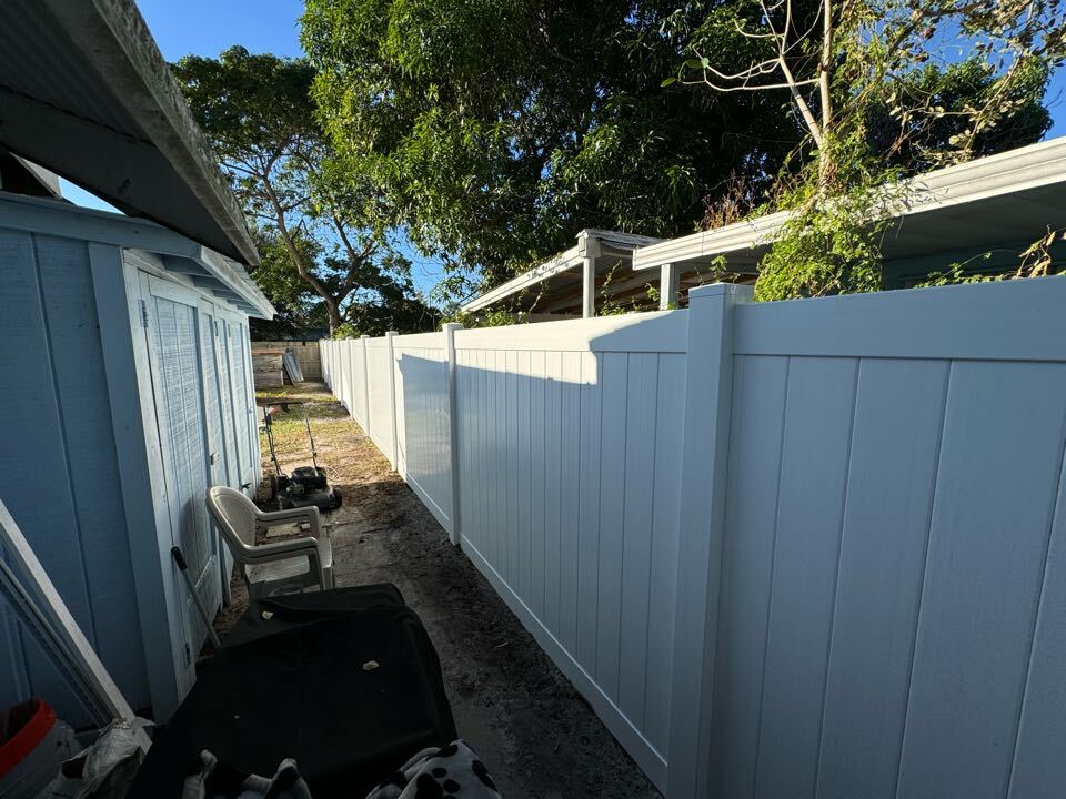 We just finished installing a 6-foot white privacy vinyl fence in West Palm Beach on both sides of a homeowner’s property. This project required navigating a tricky permitting process, including an environmental review and securing a variance through the Palm Beach County Building Department. Thanks to our expertise, we delivered a seamless installation while ensuring the fence met all regulations—just another day of going the extra mile at Top Rail Fence.