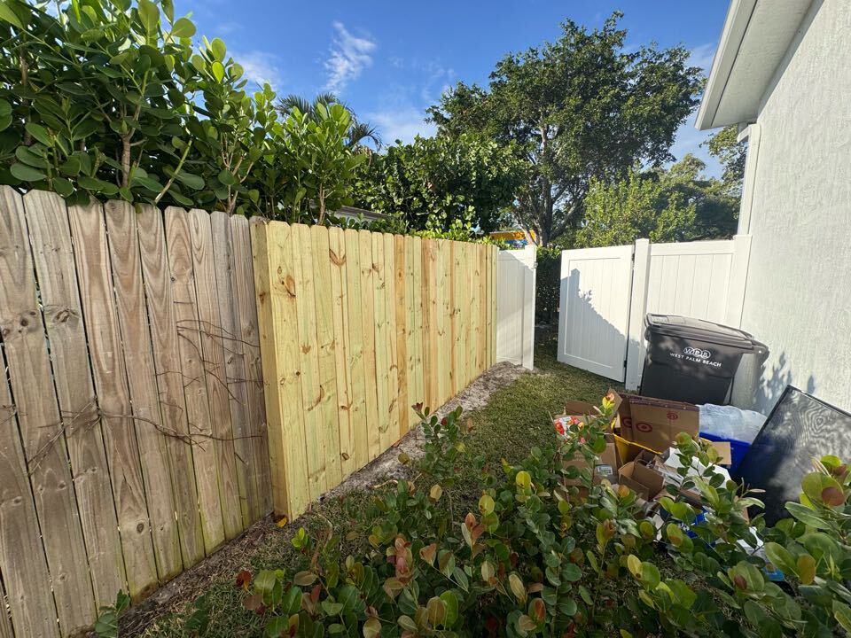 In West Palm Beach, FL, we installed a combination of fencing to secure and enhance this property. The project included a 6-foot-tall white privacy fence on both sides of the home, 4-foot black chain link along the left side, and a 6-foot wood stockade section to fill in a missing area on the right. 