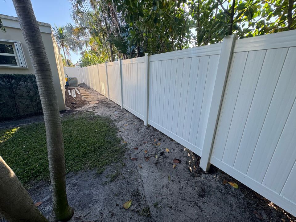 In West Palm Beach, FL, we removed 70 feet of old wood fencing and replaced it with a 6-foot-tall white privacy fence along the left side of a customer’s rental property. This upgrade provides a clean, modern look while enhancing privacy and durability. 