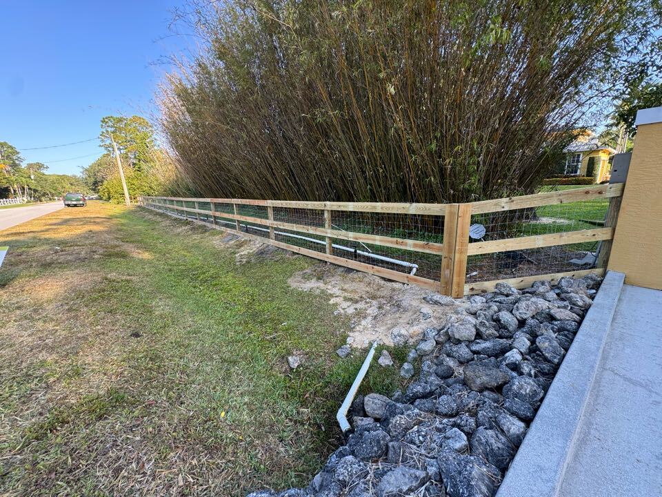 In Palm Beach Country Estates, Palm Beach Gardens, FL, we removed 440 feet of old fencing and replaced it with 255 feet of 4-foot-tall black chain link along the side of the home, and 196 feet of 3-rail post and wire fence across the front. We knocked the project out in just two days and handled the permitting to keep things easy for the customer.