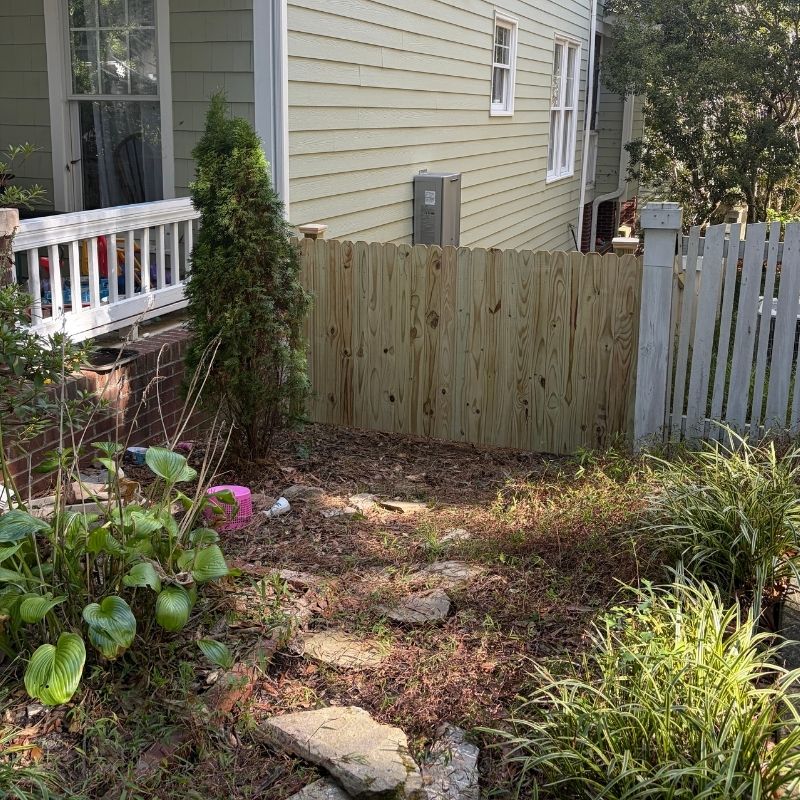 Wood stockade fence installed by Top Rail Fence