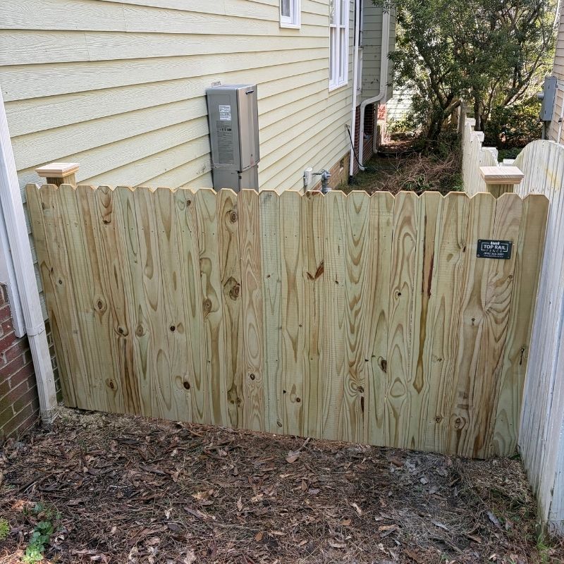 Wood stockade fence installed by Top Rail Fence