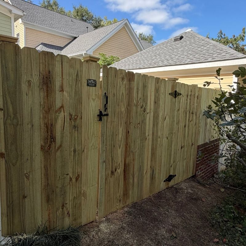 Wood stockade fence installed by Top Rail Fence