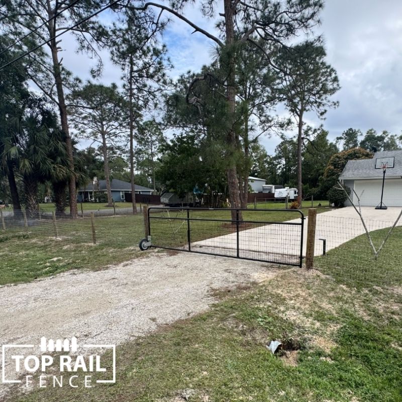 New agricultural cattle fence with driveway gate