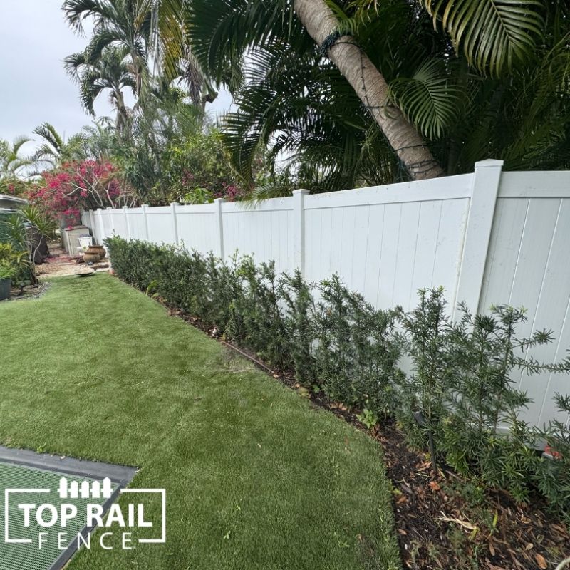 White vinyl fence installed by Top Rail Fence