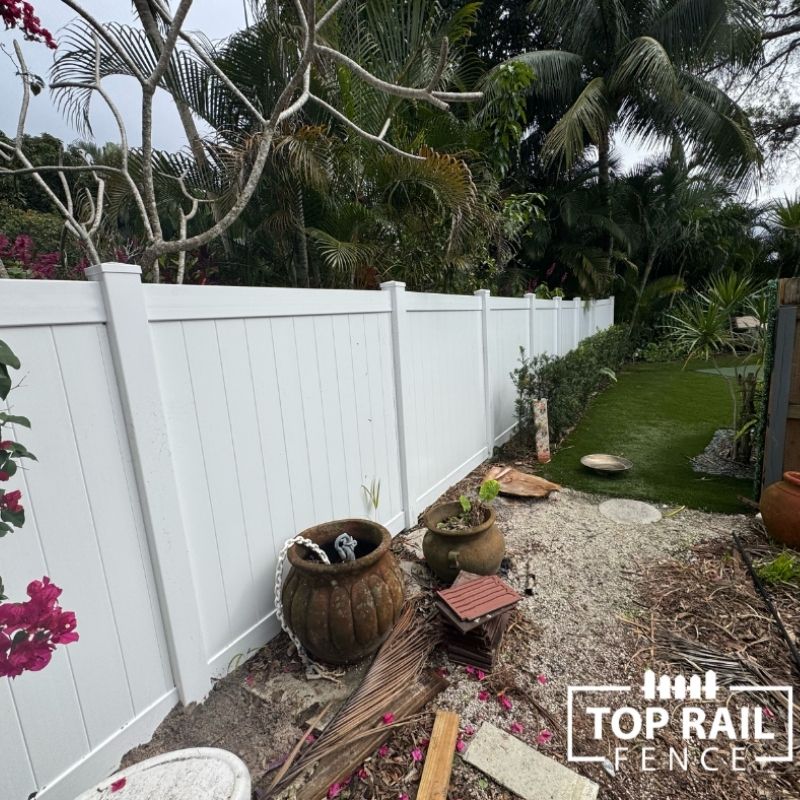 white vinyl fence installed by Top Rail Fence