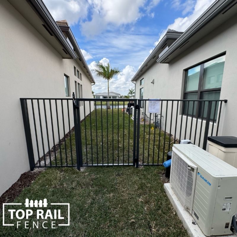 New aluminum pool fence installed by Top Rail Fence