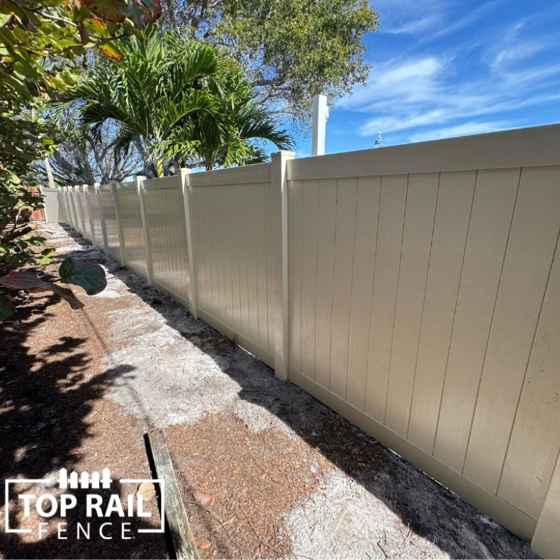 white vinyl fence installed by Top Rail Fence