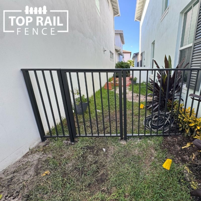 aluminum fence installed by top rail fence
