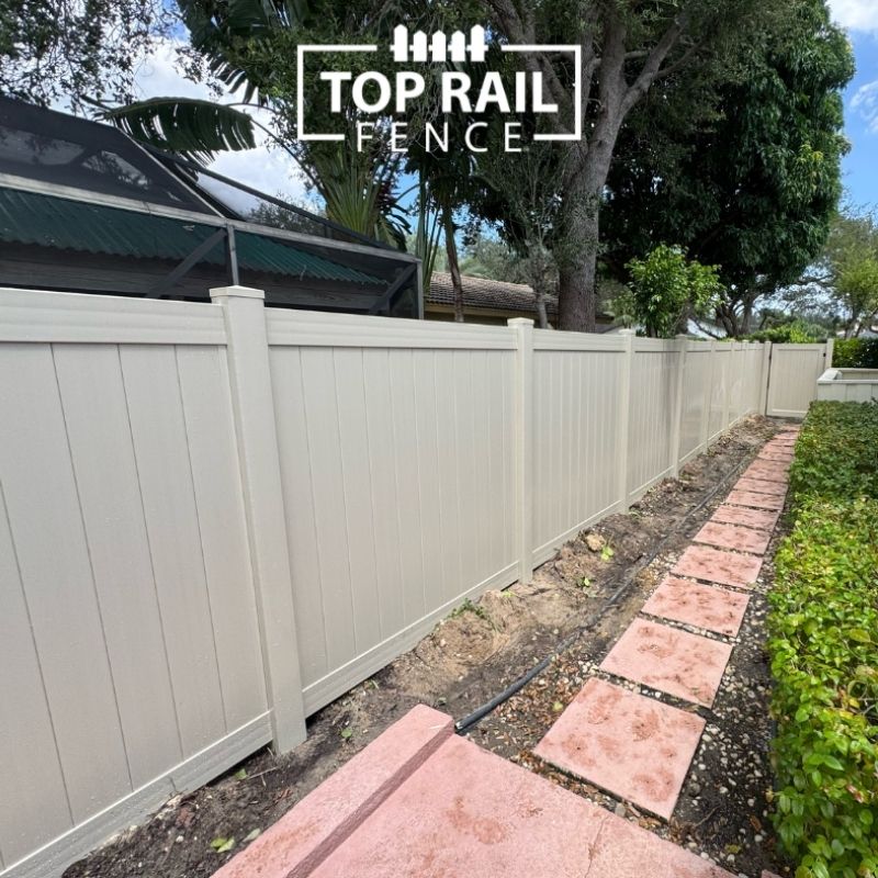 Tan Vinyl Fence installed by Top Rail Fence