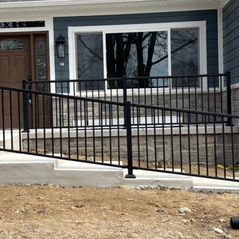 ornamental metal handrail installed by top rail fence