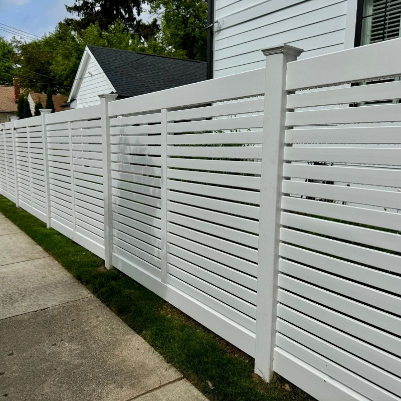 Horizontal composite fence installed by Top Rail Fence