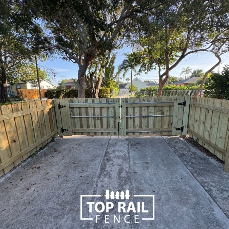 wood and aluminum fence installed by top rail fence