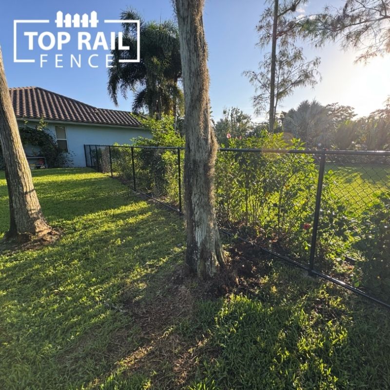 chain link fence installed by top rail fence