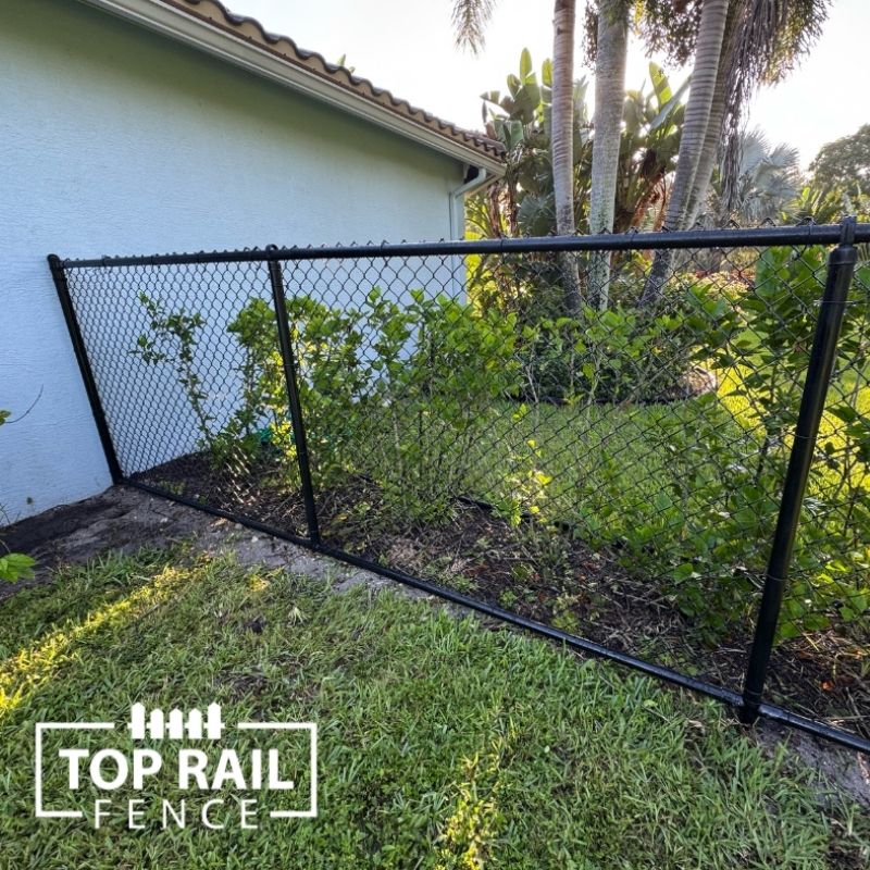 chain link fence installed by top rail fence