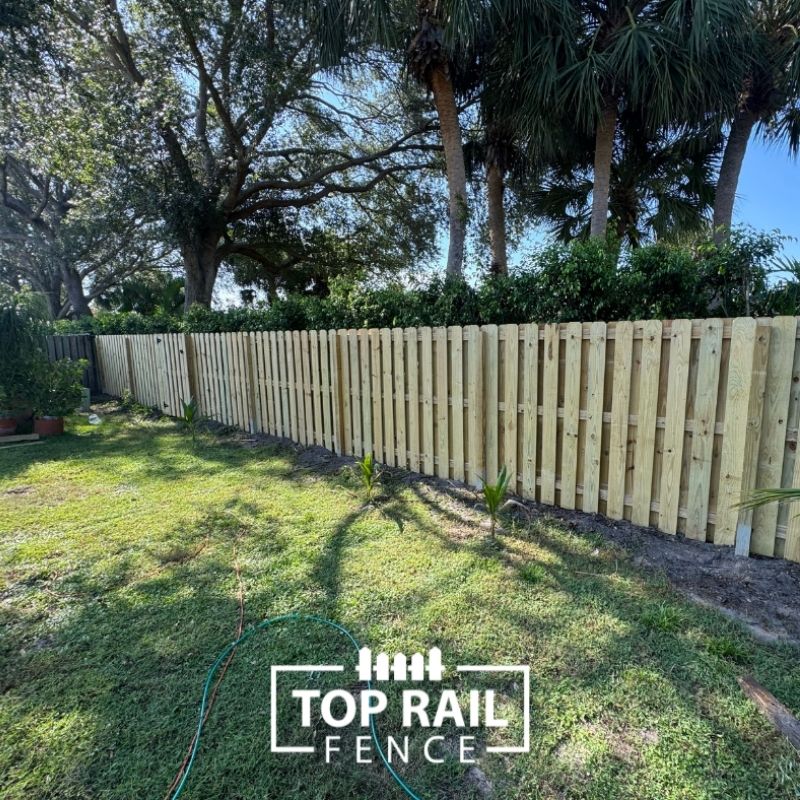 wood shadowbox fence installed by top rail fence