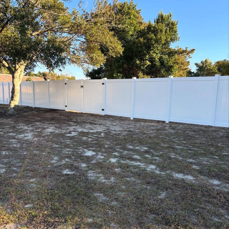 backyard with a white vinyl fence