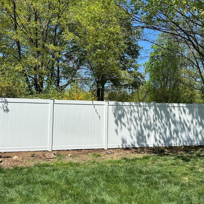White vinyl privacy fence installed by Top Rail Fence