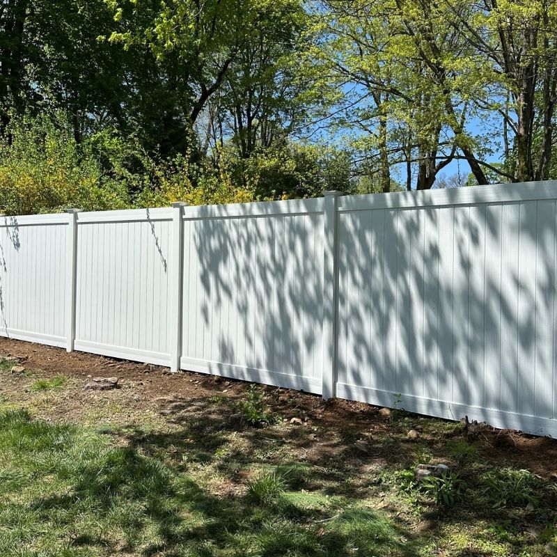White vinyl privacy fence installed by Top Rail Fence