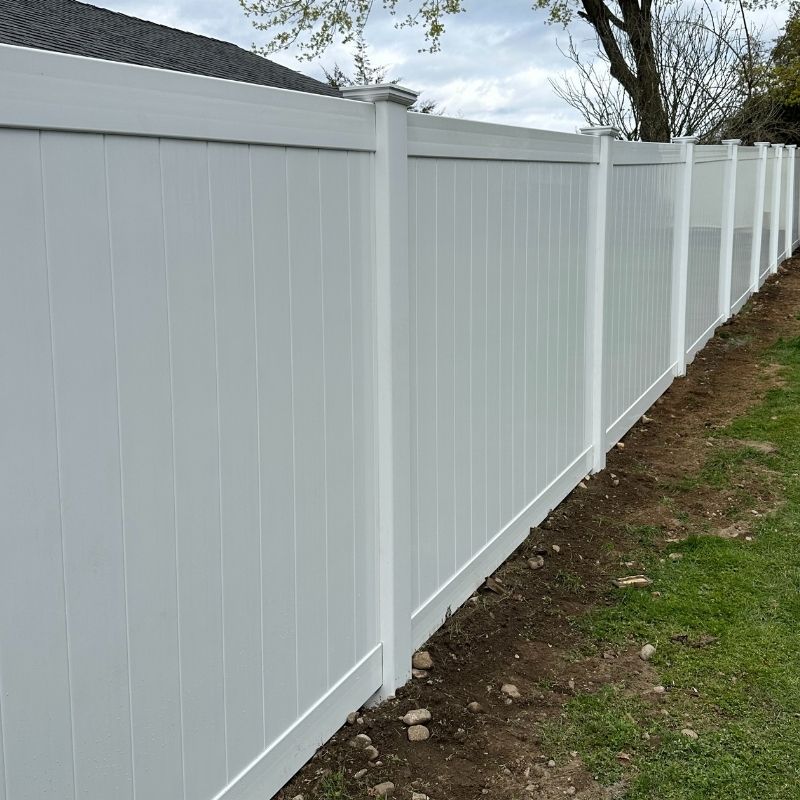 white vinyl privacy fence installed by Top Rail Fence