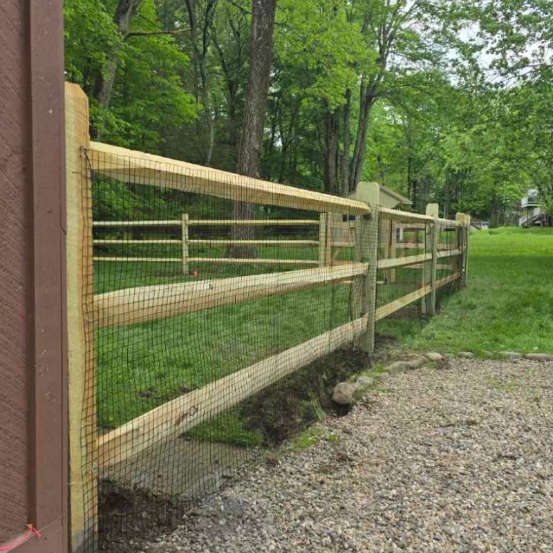 Split Rail Fence with Mesh Wire installed by Top Rail Fence