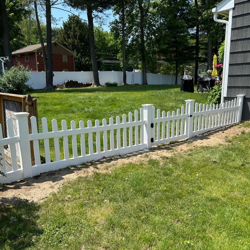 white vinyl fence installed by Top Rail Fence