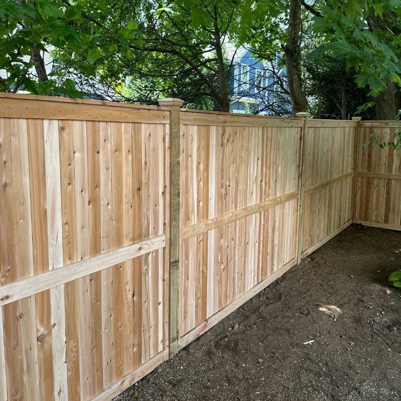 privacy fence installed by top rail fence