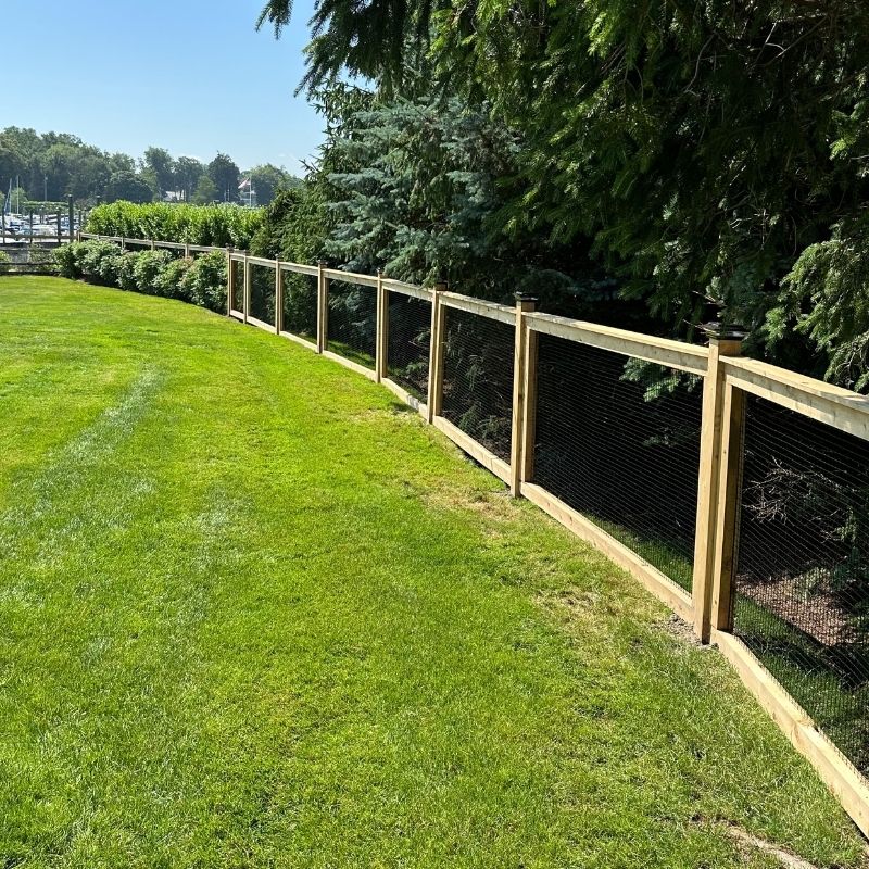 cedar fence installed by top rail fence