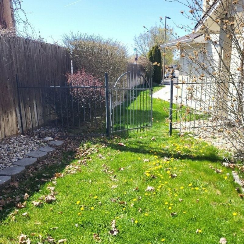 Fenced in entry way to backyard