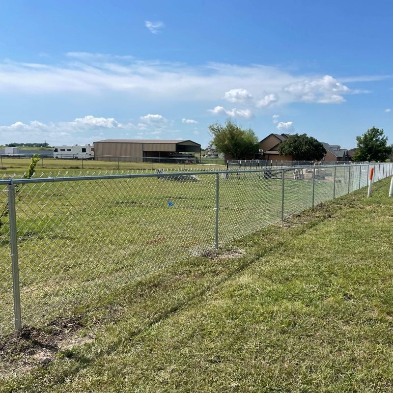 chain link fence installed by top rail fence
