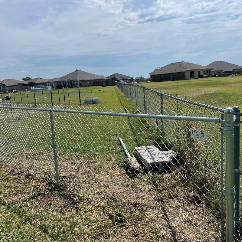chain link fence installed by top rail fence