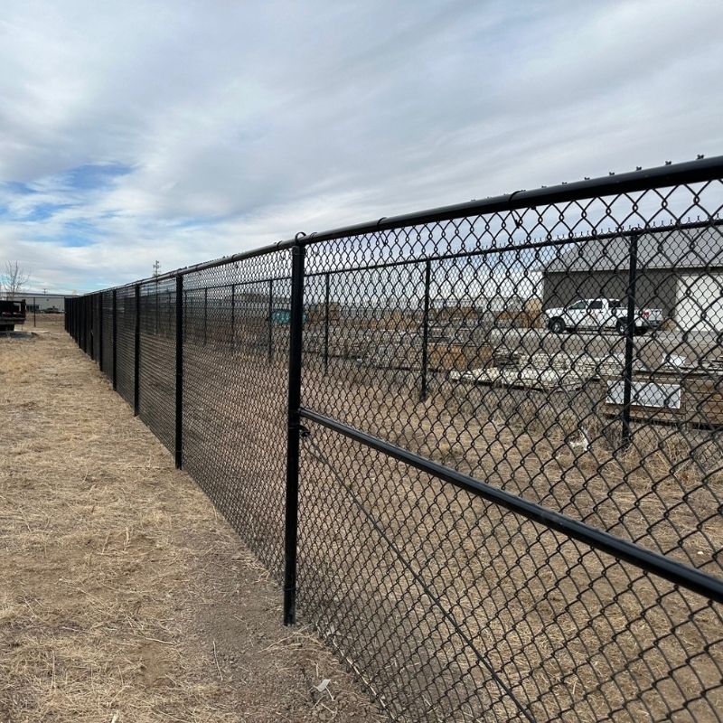 black chain link commercial fence installed by Top Rail Fence