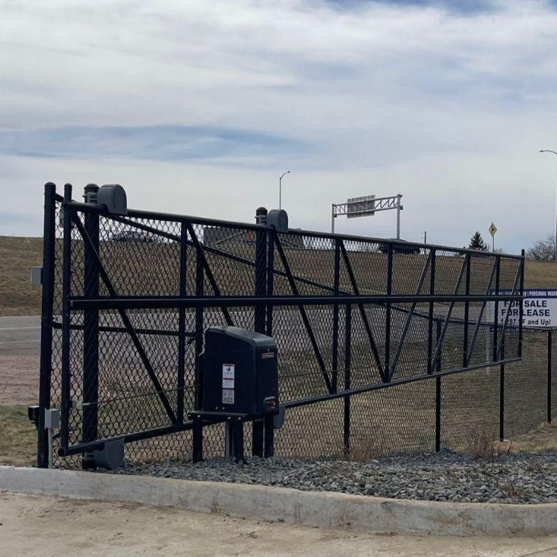 black chain link commercial gate installed by Top Rail Fence