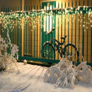 cascading lights metal picket fence