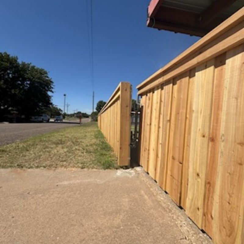 Board on Board fence installed by Top Rail Fence